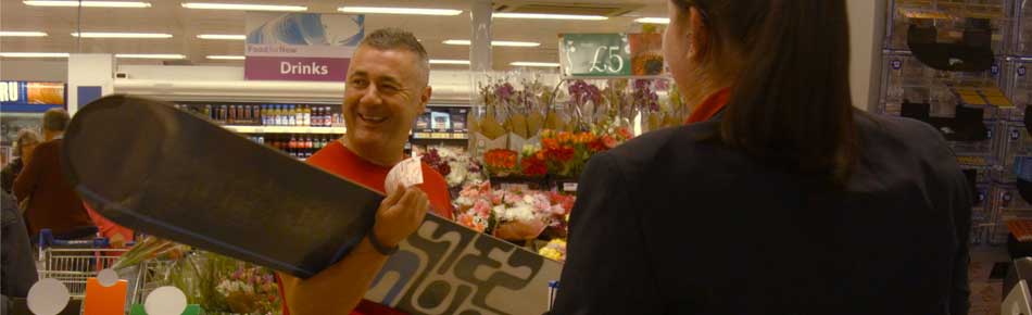 Video of unsuspecting shoppers receiving surprise gifts when buying a lottery ticket